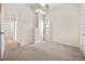 Simple bedroom with neutral walls and carpet flooring at 1516 Lafayette St, Denver, CO 80218