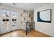 Bright entryway with built-in shelving, hardwood floors, and French doors at 1516 Lafayette St, Denver, CO 80218