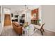 Open living area with exposed brick wall and comfortable seating at 1516 Lafayette St, Denver, CO 80218