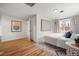 Spacious bedroom with hardwood floors and ample natural light at 1516 Lafayette St, Denver, CO 80218