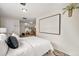 Bright bedroom with ensuite access and built-in shelving at 1516 Lafayette St, Denver, CO 80218