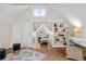 Spacious bonus room with built-in shelving and a cozy sitting area at 1516 Lafayette St, Denver, CO 80218