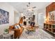 Living room with leather couch and exposed brick wall at 1516 Lafayette St, Denver, CO 80218