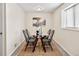 Bright dining room featuring a glass table and four chairs at 1516 Lafayette St, Denver, CO 80218