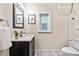 Clean bathroom with updated vanity and fixtures at 1516 Lafayette St, Denver, CO 80218