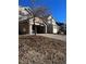 Exterior view of home's garage and landscaping at 5492 S Cathay Way, Centennial, CO 80015