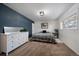 Bedroom with a dresser and accent wall at 534 S Xenon Ct, Lakewood, CO 80228