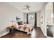 Bright bedroom with wood floors, large windows, and a ceiling fan at 3250 Via Margarita, Castle Rock, CO 80109