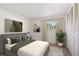 Bedroom with bed, closet, and window at 1289 S Monaco Pkwy, Denver, CO 80224
