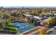 Aerial view of townhomes near tennis courts and a large park at 1289 S Monaco Pkwy, Denver, CO 80224