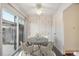 Cozy dining area with a round table and built in cabinets at 1289 S Monaco Pkwy, Denver, CO 80224