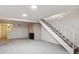 Bright living room featuring a fireplace and stairs at 1289 S Monaco Pkwy, Denver, CO 80224