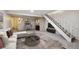 Spacious living room with fireplace and view to backyard at 1289 S Monaco Pkwy, Denver, CO 80224