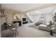 Modern living room features a fireplace and plenty of natural light at 1289 S Monaco Pkwy, Denver, CO 80224