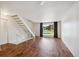 Bright living room with hardwood floors and access to exterior at 1289 S Monaco Pkwy, Denver, CO 80224
