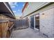 Private patio with brick wall and covered parking at 1289 S Monaco Pkwy, Denver, CO 80224