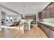 Modern kitchen with island, stainless steel appliances and hardwood floors at 16439 Arrow Peak Way, Broomfield, CO 80023