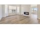 Bright living room featuring a modern fireplace and large windows at 3820 Treadway Pt, Castle Rock, CO 80108