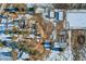 Aerial view of a property with house and various outbuildings at 6597 S State Highway 83, Franktown, CO 80116