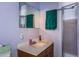 Clean bathroom with single sink vanity and shower stall at 6597 S State Highway 83, Franktown, CO 80116