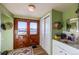 Entryway with double doors, hats on wall, and sink at 6597 S State Highway 83, Franktown, CO 80116
