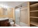 Bathroom with shower/tub combo, vanity, and shelving at 17274 E Princeton Dr, Aurora, CO 80013