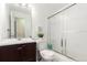 Bathroom with tub, shower, and single sink vanity at 11941 Bellaire St # B, Thornton, CO 80233