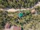 0.39-acre property featuring a cabin and surrounding landscape at 80 Outlook Dr, Golden, CO 80403