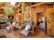 Living room with wood walls, a view into the bedroom, and a rustic feel at 80 Outlook Dr, Golden, CO 80403