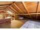 Upstairs loft bedroom with wood-beamed ceiling and a built-in sleeping platform at 80 Outlook Dr, Golden, CO 80403