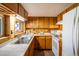 Simple kitchen with wood cabinets, and modern appliances at 80 Outlook Dr, Golden, CO 80403