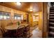 Dining area with wood floors and a view into the kitchen at 80 Outlook Dr, Golden, CO 80403