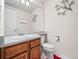 Clean bathroom with wood cabinets and a large mirror at 3873 S Halifax St, Aurora, CO 80013