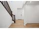 Inviting entryway with wood-look floors and staircase at 2022 Wagon Wheel Aly, Brighton, CO 80601