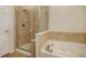 Clean bathroom with shower/tub combo and neutral tile at 6656 S Shawnee St, Aurora, CO 80016