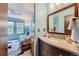 Small bathroom with a vanity, granite countertop, and mirror at 2718 S Victor St, Aurora, CO 80014