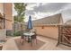 Small patio with a table, chairs, and umbrella at 2718 S Victor St, Aurora, CO 80014