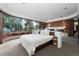 Main bedroom with fireplace, large windows, and private access to patio at 30786 Snowbird Ln, Evergreen, CO 80439
