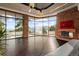 Spacious Gathering room with a stone fireplace and panoramic windows at 30786 Snowbird Ln, Evergreen, CO 80439