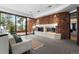 Relaxing Gathering room with stone fireplace and scenic views at 30786 Snowbird Ln, Evergreen, CO 80439