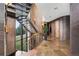 Modern metal staircase with wood accents and natural light at 30786 Snowbird Ln, Evergreen, CO 80439