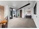 Spacious hallway with wood flooring and modern wall decor at 30786 Snowbird Ln, Evergreen, CO 80439