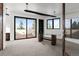 Bright home office with glass doors opening to a private balcony at 30786 Snowbird Ln, Evergreen, CO 80439
