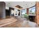 Open living area with large windows, fireplace, and unique architectural details at 30786 Snowbird Ln, Evergreen, CO 80439