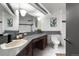 Elegant bathroom with double vanity and mosaic tile at 30786 Snowbird Ln, Evergreen, CO 80439