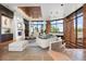 Open living room with large windows and mountain views at 30786 Snowbird Ln, Evergreen, CO 80439