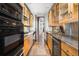 Sleek kitchen with stainless steel appliances and custom cabinetry at 30786 Snowbird Ln, Evergreen, CO 80439