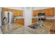 Modern kitchen with stainless steel appliances and granite countertops at 1851 Lochmore Dr, Longmont, CO 80504