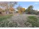 Spacious backyard with mature trees and landscaping at 3955 S Uinta St, Denver, CO 80237