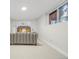 Spacious basement bedroom with a plush bed and window at 3955 S Uinta St, Denver, CO 80237